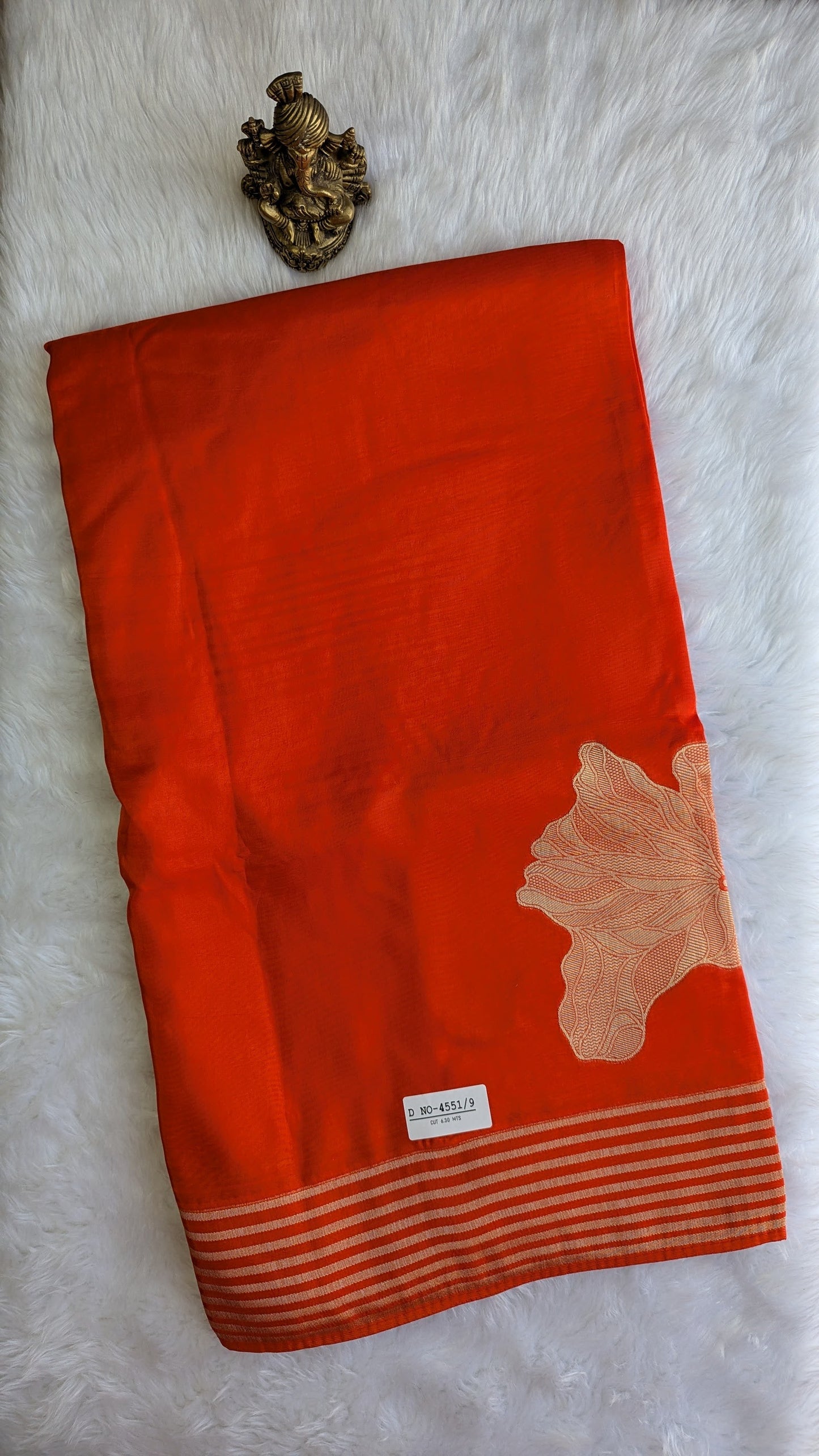 Rust Orange Crepe Silk with Big Zari Flower Motifs