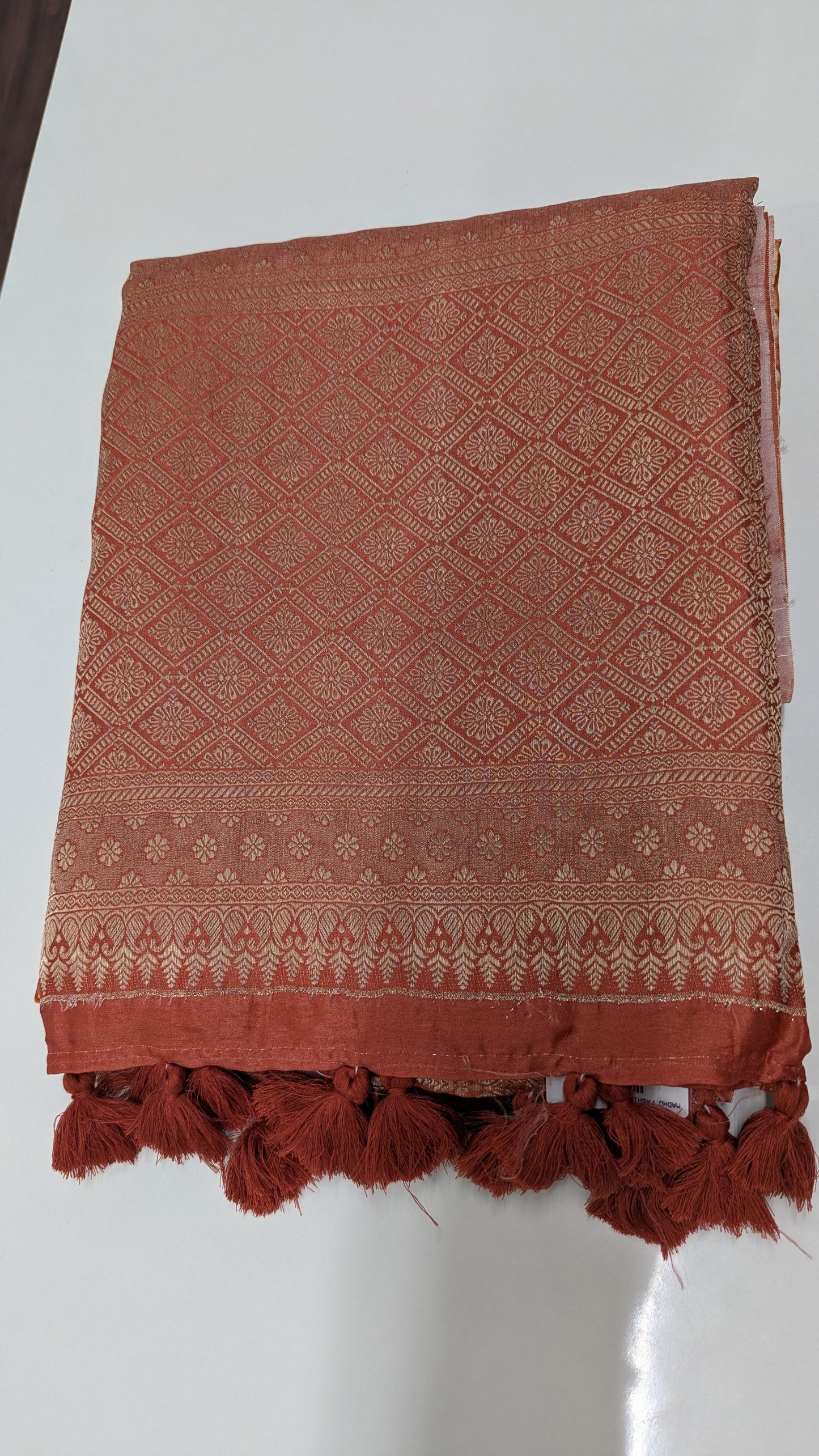 Rust Orange Crepe Silk Saree with Antique Zari