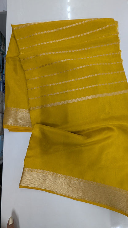 Mustard color Semi Crepe Silk Saree with Center Zari Lines and Border