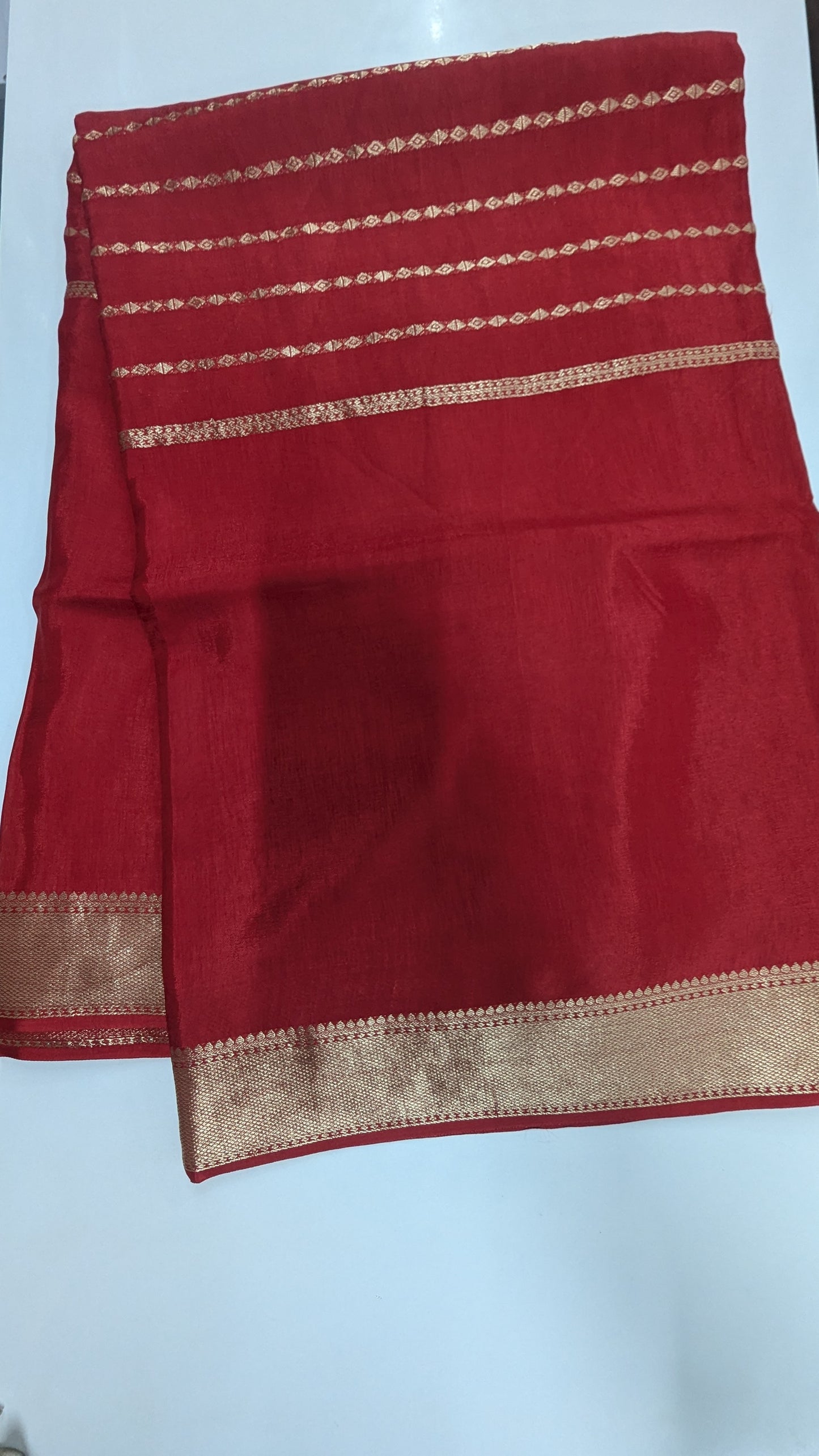 Red color Semi Crepe Silk Saree with Center Zari Lines and Border